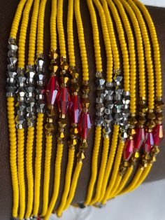 This meticulously handcrafted waist bead is designed to illuminate your silhouette with the cheerful glow of sunshine. Immerse yourself in the inviting warmth and lively charm of this waist bead, created to bring a touch of positivity and vibrancy to your style. ☀️ Yellow Glass Seed Beads - Radiant Joy: This waist bead is adorned with yellow glass seed beads, symbolizing radiant joy and positivity. Yellow is a color associated with energy and happiness, bringing a sunlit warmth to the waist bead Multi-strand Beaded Waist Beads For Festival, Adjustable Beaded Waist Beads For Festivals, Bohemian Style Colorful Waist Beads, Adjustable Faceted Beads Waist Beads For Festival, Adjustable Faceted Waist Beads For Festivals, Yellow Beaded Bracelet For Party, Adjustable Beaded Waist Beads As Gift, Gift Waist Beads With Tiny Beads, Gift Waist Beads With Small Beads