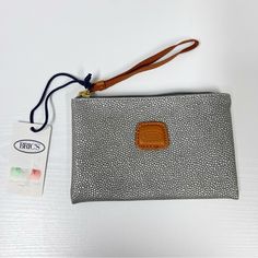 New With Tags Wristlet. Small Area Of Stickiness To Tag. Measurements Approximately 7 1/4x4 3/4” Elegant Silver Wristlet For Everyday Use, Wristlet Clutch, Brown Silver, Leather Wristlet, Pebbled Leather, Clutches, Bag Lady, Tags, Leather