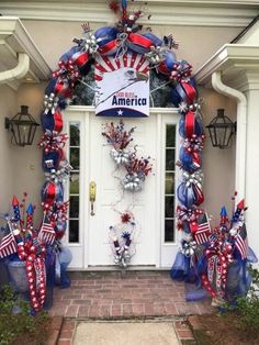 an american patriotic door decoration with red, white and blue decorations