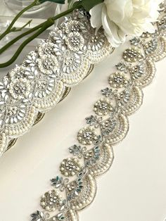 A beautifully crafted Pearl and Zircon trim with detailed thread work. Add this to your basic ethnic attire or attach it to your summer ball dress and turn it into a luxurious blend of art.  We are constantly adding new items and you will be sure to find our complete inventory with 1000's of designs at www.lacetrimssindia.com PLEASE NOTE : ALL ORDERS ARE SHIPPED FROM THE INDIA RETURN POLICY *All broken case can be re-sent or refund if the condition is proven by photo . *Exchange item or refund c Elegant Embroidered Wedding Trims, Traditional Embellished Trims For Wedding, Festive Embroidered Bridal Belt, Summer Ball Dress, Summer Ball Dresses, Lace Lehenga, Wedding Gown Lace, Summer Ball, Flower Girl Headpiece