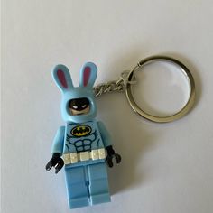 a lego keychain with a batman character in the shape of a bunny rabbit