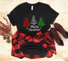 Merry Christmas Shirt, Red White Green Plaid Trees T-Shirt, Christmas Tree Shirt, Holiday Shirt, Christmas Gift, Buffalo Plaid Xmas Shirt This Bella Canvas Unisex T-shirt fits like a well-loved favorite. Super soft cotton and excellent quality print make one fall in love with it over and over again. Sizing is UNISEX. It will fit true to size for men, and a little more loosely and longer than your typical women's tee (great for wearing with leggings). Please size down if you prefer a more fitted look or if you are worried about it running small then size up. Please see the images for the size chart, and please don't hesitate to message me with any questions.  A rough guideline of sizes are X-Small (0-2) Small (4-6) Medium (8-10) Large (12-14) XL (16-18) Want this design on a different style Buffalo Plaid Christmas Tree, Womens Christmas Shirts, Cute Birthday Gift, Christmas Tree Shirt, Buffalo Plaid Christmas, Merry Christmas Shirts, Xmas Shirts, Tree Shirt, Holiday Shirt