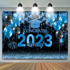 graduation party backdrop with balloons and confetti