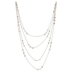 Long chain yard diamond white gold necklace, 18 karat white gold Fifty-seven diamonds, including round brilliant-cut, princess-cut, pear-cut, marquise-cut, oval-cut, and emerald-cut; diamonds have a faint color (K - M), with I clarity; total estimated weight of diamonds is approximately 16.40 carats Size: length 63 inches Total weight: 19.5 grams Cheap Adjustable White Long Necklace, Gold Long Chain, White Gold Necklace, White Gold Necklaces, Marquise Cut, Long Chain, Pear Cut, Princess Cut, Emerald Cut