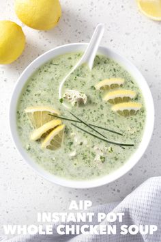 a bowl of chicken soup with lemons and parsley on the side for instant pot