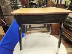 an old school desk is on display in a shop