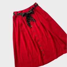 "Vintage Norton McNaughton red skirt with buttons down the front 80's 90's Marked size 6 but please refer to measurements as vintage sizes can differ Removable belt - has beads at the end Length: appx 29\" Waist: 12.5\" but can comfortably stretch to 13.5\" 50% polyester 50% rayon Please feel free to ask any questions!" Red Formal Skirt For Summer, Vintage Red Skirt For Party, Fitted Red Skirt With Button Closure, Vintage Red Party Skirt, Red Button Closure Skirt For Summer, Red Summer Skirt With Button Closure, Spring Red Buttoned Skirt, Red Buttoned Skirt For Spring, Red Buttoned Skirt For Summer