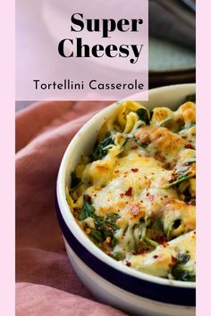 a white bowl filled with tortelli casserole on top of a pink towel