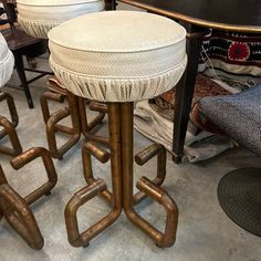 the stools are made out of pipes and have been used as footstools