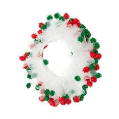 a white wreath with red and green pom - poms