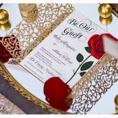 a red rose is placed on top of a gold and white wedding card that reads, bow gift