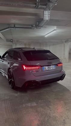 an audi car parked in a parking garage