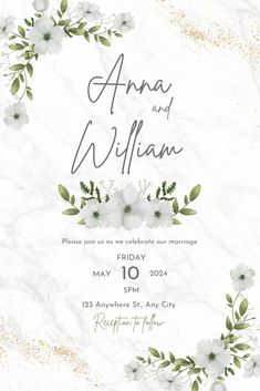 an elegant wedding card with white flowers and greenery in the middle, on a marble background