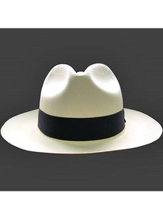 Brand: Gamboa PremiumColor: Natural Material: Toquilla Straw Brim: 7 - 8 cm. (2.76"- 3.16")Grade: 19 - 20 (Fine Fine)learn more Sweatband: Cotton Twill, 3 cm. (1.18") Crown: 10.37 - 10.87 cm. (4.1" - 4.3") Ribbon: Linen Description: A luxurious hat, handmade in Montecristi, the worldwide famous Panama Hat town in Ecuador. This Panama Fedora hat (Tuis) is a top quality, classic and elegant hat. Each hat is individually blocked and trimmed to meet the highest quality standards.Each Gamboa Premium Poncho Pullover, Elegant Hats, Premium Colors, Quality Hats, Cow Boy, Fedora Hat, Natural Material, Hat Making, Straw Hat