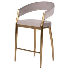 an upholstered chair with a gold frame and grey velvet seat, against a white background