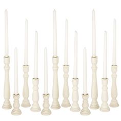 white candles are lined up in rows on a white background, with one candle lit and the other turned off