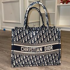 Authentic Dior Tote Medium Bag Ecru And Blue Color Used But Excellent Condition See Pics Only Used 3x Well Kept Clean Interior Comes With Dust Bag Only Designer Blue Bags For Shopping, Designer Blue Bag For Shopping, High-end Blue Tote Shoulder Bag, Designer Blue Shopping Bags, High-end Blue Bag With Double Handle, High-end Blue Bags For Shopping, Luxury Blue Tote Bag, Luxury Bags Collection, Multipurpose Bag