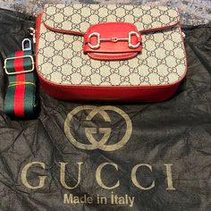 Nice Red Gucci Purse For Someone Who Loves A Small Purse To Tote Along With You Good For Any Occasion You Can Carry This Bag On Your Shoulder In Style Designer Red Shoulder Bag, Designer Red Shoulder Bag As Gift, Gucci Red Shoulder Bag For Everyday Use, Gucci Bags Handbags Red, Red Gucci Bag, Red Gucci Shoulder Bag For Shopping, Red Gucci Bag With Chain Strap, Gucci Red Bag With Removable Pouch, Red Gucci Shoulder Bag With Gold-tone Hardware