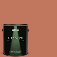 the behr marquee paint is shown in an open pink color with a green tint