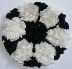 white and black flowers arranged in a circle