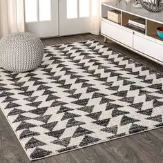 a black and white rug in a living room