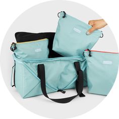 Wishing there was a better way to pack for your Pup? Bernal Go Bag is a super versatile, transforming travel bag designed to keep all of your dog’s essentials together and easily accessible. It can go from a cube bag to a duffle twice the size in a flash, while the 3 inner pouches with color-coded zippers help you pack smarter and stay organized. Whether you’re packing for beach picnics, weekend getaways or emergency scenarios, Bernal Go Bag is here to help you & Beest prepare for any adventure! Functional Duffle Bag With Removable Pouch For On-the-go, Rectangular Nylon Duffle Bag For Everyday Use, Functional Outdoor Bags With Luggage Sleeve, Multifunctional Everyday Duffle Bag Backpack, Functional Outdoor Bag With Luggage Sleeve, Nylon Rectangular Gym Bag For Everyday Use, Functional Shoulder Bag For Overnight Trips, Versatile Travel Tote Bag With Functional Pockets, Large Capacity Backpack Lunch Bag For Travel