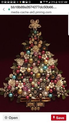 a small christmas tree made out of ornaments