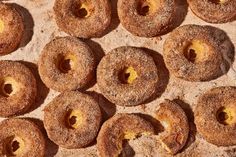 several donuts with holes in them sitting on a table