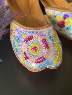 Traditional shoe/jutti RAINBOW. Made in Punjab, india. Entire shoe is made of genuine leather. For total comfort double cushion added. Leather lining to the side. Front and back has jari and head work. Completely hand made. Multicolor Slip-on Flats For Festival, Bohemian Festive Flats With Round Toe, Navratri Flats With Gota Work For Festival, Navratri Festival Flats With Gota Work, Handwork Flats For Summer Festival, Handwork Round Toe Festival Flats, Handwork Round Toe Flats For Festival, Bollywood Style Zari Work Flats For Festival, Bollywood Flats With Zari Work For Festival