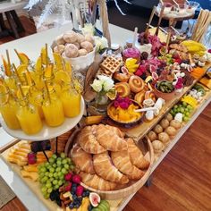 a table filled with lots of different types of food and drinks on top of it