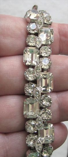 "Vintage Eisenberg Ice rhinestone Bracelet. This is in excellent, clean, undamaged condition. No missing,bad, dull or yellowed rhinestones. No noticeable wear or damage to rhodium plated silver tone frame. Features 2 rows of dentelle (round, premium rut) and octogon rhinestones. Measures 7 1/16\" x 5/8\"." Dazzling Crystal Tennis Bracelet With 17 Jewels, Classic Formal Bracelets With Rhinestones, Formal Jeweled Crystal Bracelets, Dazzling Formal Crystal Bracelet With Bling, Diamond Tennis Bracelet With Rhinestones For Formal Occasions, Vintage Crystal Bracelet With Sparkling Stones For Formal Occasions, Vintage Crystal Bracelets For Formal Occasions, Formal Vintage Crystal Bracelet With Sparkling Stones, Dazzling Rhinestone Bracelets For Formal Occasions