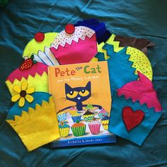 there is a book about pete the cat and cupcakes on top of it