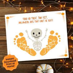 a halloween card with an image of a skeleton and pumpkins on the table next to it