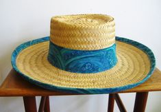 Very fun vintage 50s 60s woven straw sun hat has a blue cotton band. Hat is 15" x 14" and the hat band is 21.5 inches around. In excellent condition. Will ship worldwide. Thanks! Vintage Blue Adjustable Hat Bands, Blue Retro Vacation Hats, Retro Blue Beach Hat, Retro Brimmed Sun Hat For Vacation, Retro Wide Brim Sun Hat For Vacation, Blue Flat Brim Hat Bands For Vacation, Blue Woven Straw Hat For Beach, Retro Adjustable Straw Hat For Vacation, Adjustable Retro Straw Hat For Vacation