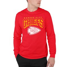 a man wearing a kansas city chiefs shirt