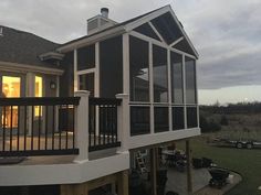 a house with a deck and screened porch