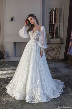 a woman in a wedding dress posing for the camera with her hand on her head