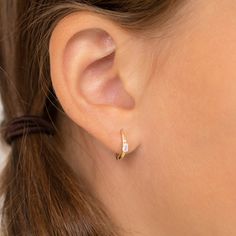 Fall in love with these unique 14k gold hoop earrings for little girls. These stunning hoop earrings feature a beautiful baguette cut cubic zirconia stone at its center and are easy to pair with your little girls favorite accessories and outfits. Finely crafted from 14k yellow gold, these earrings are a beautiful and safe option for young girls who have sensitive ears. Packed in a cute gift box for easy gifting. 14k Gold Hoop Earrings, Classic Accessories, Kids Necklace, Sell Gold, Finger Rings, Huggie Earrings, Yellow Gold Earring, Baguette Cut