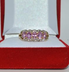 Please find for sale a 9ct Gold - Pink Sapphire & Diamond Ring Which is fully hallmarked for 9ct Gold. Pink Sapphires of marvellous clarity, colour & cut. Exhibiting good lustre. Diamonds bright and lively Ring size N - USA size 6 3/4. This piece is used but in extremely good condition and comes in a velvet ring box. Pink Sapphire Diamond Ring, Velvet Ring Box, Sapphire Diamond Ring, Sapphire Diamond, Cut And Color, Ring Box, Pink Sapphire, Rings Statement, Favorite Jewelry