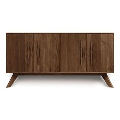 the sideboard is made out of wood and has three doors, two drawers and one door