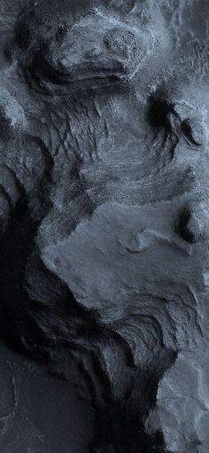 an aerial view of the earth's terrain in black and white, as seen from space