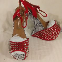 Jeffrey Campbell Heel-Less Spiked Shoe. Size 7.5 M, Vicious Style, And You Will Be Vicious Wearing These Amazing Shoes! Zebra Print And Red With Silver Spikes. New In Box, Excellent Condition! Inner Studs And Outer Spikes For Ease In Walking. Show Your Amazing Style With These Shoes! Wish I Could Keep! Heel Height 6.5in Platform Approx 2.5. Easy To Walk In.... Don't Injure Anyone With Your Vicious Style. Party Sandals With Spikes, Synthetic Material, Party Sandals With Spikes In Synthetic Material, Party Synthetic Sandals With Spikes, Red Sole Wedge Heel Evening Shoes, Party Sandals With Red Sole And Wedge Heel, Evening Wedge Heels With Red Sole, Red Spiked Heels For Party, Summer Studded Pointed Toe Heels, Formal Open Toe Heels With Studded Rubber Outsoles