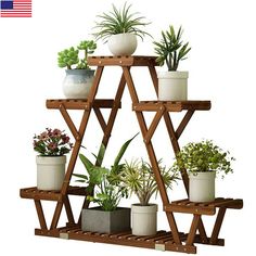 a wooden shelf filled with potted plants