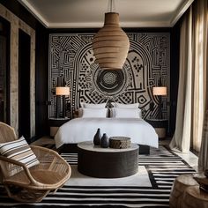 a bedroom with black and white wallpaper, wicker furniture and rattan lamps