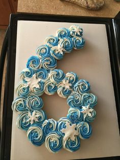 a cake shaped like the letter c with icing