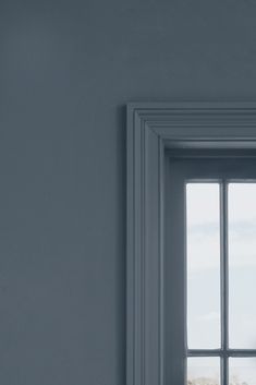 an open window in a white room