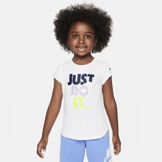 Put your child in the Sweet Swoosh life with this tee, which is made of smooth cotton/poly jersey with a regular fit they can move freely in and the tagless crewneck provides a comfy feel. Nike T-shirt With Text Print For Sports, Playful Sports Tops With Letter Print, Playful Nike Tops For Sports, Playful Short Sleeve Sports T-shirt, Playful Nike Crew Neck Top, Playful Nike Crew Neck T-shirt, Playful Nike Short Sleeve Tops, Nike Cotton T-shirt In Playful Style, White Nike T-shirt With Text Print