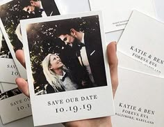 a person holding up some white cards with photos on them and the words save our date written in black