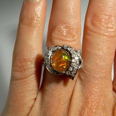 "An astonishing handmade early 1940s handmade Art Deco filigree natural precious fire opal and sparkly old cut diamond ring.  This ring is beautifully crafted. The entire ring is handmade with no cast or machined components. It is a one of a kind custom made ring from the late Art Deco period.  In total it weighs approximately 5.7 grams.  Inside the shank it is marked clearly 14K and professional testing confirms the same.  There are 32 single cut sparkly earth mined diamonds set into the floria Fire Opal Engagement Ring, Late Art, Opal Diamond Ring, Engagement Ring Art Deco, Opal Engagement Ring, Precious Opal, Fire Opal Ring, Opal Engagement, Special Ring