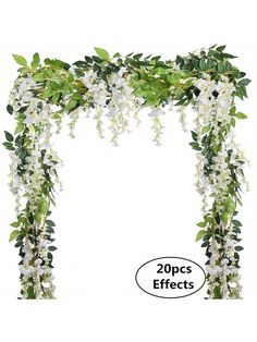 a white floral arch with green leaves and flowers